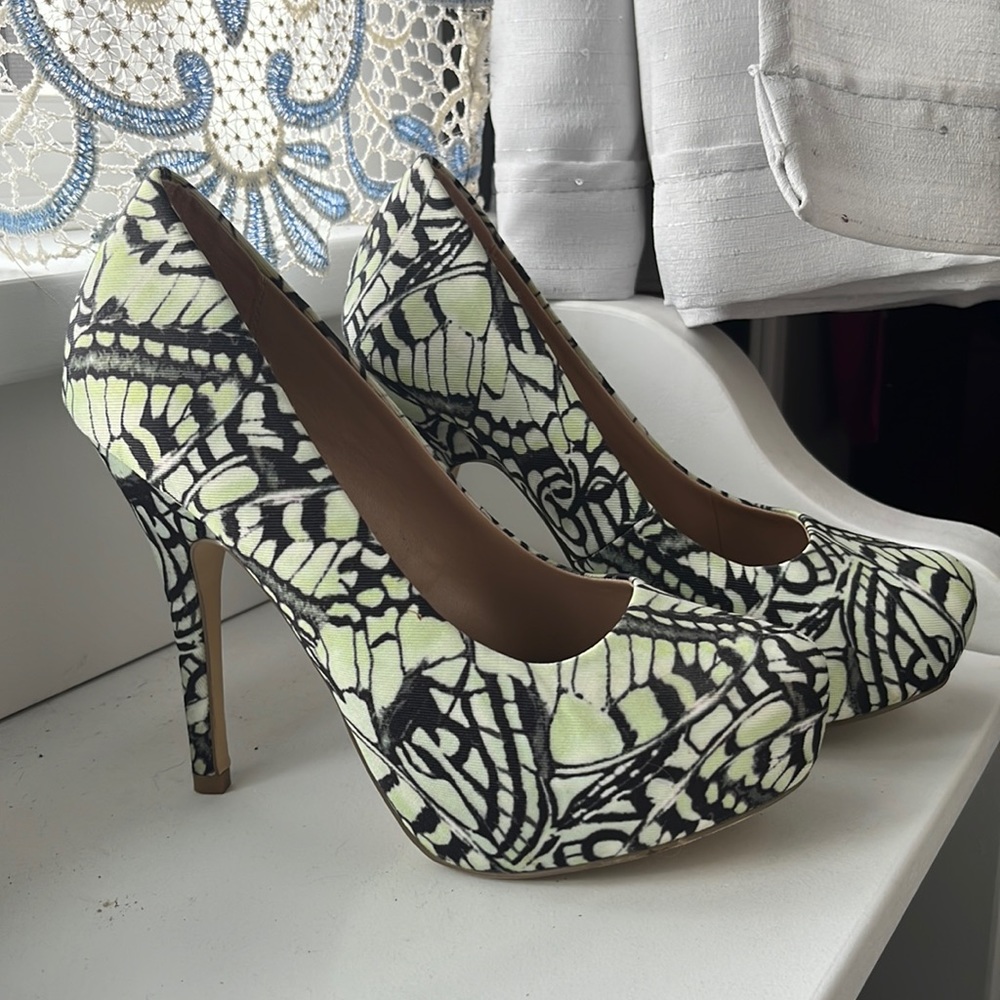 stiletto heel butterfly wings pattern in modeled light green and black.